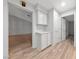 Hallway featuring built-in cabinets providing storage and a view to the living room at 9917 Arbuckle Dr, Las Vegas, NV 89134