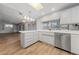 Bright kitchen featuring an island counter, sink with modern fixtures, and stainless steel appliances at 9917 Arbuckle Dr, Las Vegas, NV 89134