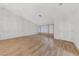 Large living room offers lots of natural light, neutral paint, and attractive wood-look flooring at 9917 Arbuckle Dr, Las Vegas, NV 89134