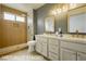 Stylish bathroom features a double vanity, modern fixtures, and a walk-in shower at 10309 Georgetown Pl, Las Vegas, NV 89134