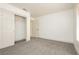 Bright bedroom features gray carpet, white walls, closet with sliding doors at 10309 Georgetown Pl, Las Vegas, NV 89134