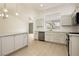 Modern kitchen featuring sleek cabinetry, stainless steel appliances, and tile backsplash at 10309 Georgetown Pl, Las Vegas, NV 89134