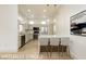 Modern kitchen features sleek countertops, stainless steel appliances, and bar stool seating at 10309 Georgetown Pl, Las Vegas, NV 89134