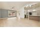 Bright, open-concept living room and kitchen with wood floors and stainless steel appliances at 10309 Georgetown Pl, Las Vegas, NV 89134