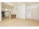Bright living area with light wood flooring, adjacent to the kitchen, and a minimalist design at 10309 Georgetown Pl, Las Vegas, NV 89134