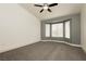 Bright main bedroom featuring a ceiling fan and bay windows with natural light at 10309 Georgetown Pl, Las Vegas, NV 89134