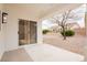 Covered patio with sliding glass doors and views of the backyard at 10309 Georgetown Pl, Las Vegas, NV 89134