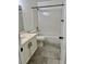 Bathroom featuring a shower-tub combo, white vanity, and neutral flooring at 1320 Driscoll Dr # 202, Las Vegas, NV 89128