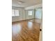 Spacious bedroom with mirrored closet doors and natural light streaming in through the window at 1320 Driscoll Dr # 202, Las Vegas, NV 89128