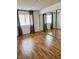 Bright bedroom featuring wood-look flooring, a large closet, and natural light from the window at 1320 Driscoll Dr # 202, Las Vegas, NV 89128