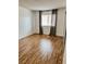 Empty bedroom with wood floors, a bright window, and a closet at 1320 Driscoll Dr # 202, Las Vegas, NV 89128