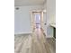 Hallway featuring clean walls and light colored flooring, leading into other rooms at 1320 Driscoll Dr # 202, Las Vegas, NV 89128