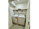 Functional laundry room with washer, dryer, and convenient shelving for storage at 1320 Driscoll Dr # 202, Las Vegas, NV 89128