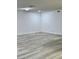 Bright, blank living room with modern flooring and clean, white walls; ready for personalization at 1320 Driscoll Dr # 202, Las Vegas, NV 89128