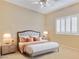 Cozy bedroom featuring a comfortable queen-size bed, side tables, and a window at 1405 Peyton Stewart Ct, North Las Vegas, NV 89086
