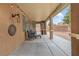Relaxing covered patio with string lights, comfortable seating, and a patio heater at 1405 Peyton Stewart Ct, North Las Vegas, NV 89086