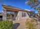 Home's backyard featuring a desert landscape and a covered patio with a chair at 1510 Fieldbrook St, Henderson, NV 89052