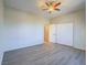 Bedroom with hardwood floors, neutral paint, a ceiling fan, and a closet with folding doors at 1510 Fieldbrook St, Henderson, NV 89052