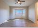 Bright bedroom featuring hardwood floors, a bay window, and neutral wall paint at 1510 Fieldbrook St, Henderson, NV 89052