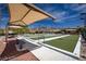 Beautiful bocce ball court featuring covered seating, manicured landscaping and views of the surrounding mountains at 1510 Fieldbrook St, Henderson, NV 89052