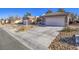 Charming home featuring a two-car garage, desert landscaping, and a welcoming entrance at 1510 Fieldbrook St, Henderson, NV 89052