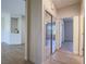 Bright hallway with hardwood floors, closet with mirrored doors, and neutral wall paint at 1510 Fieldbrook St, Henderson, NV 89052