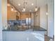 Kitchen with granite countertops, stainless steel appliances, and modern lighting at 1510 Fieldbrook St, Henderson, NV 89052