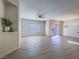 Open living room with wood floors, a large window, and a sliding glass door leading to outdoor space at 1510 Fieldbrook St, Henderson, NV 89052