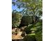 Landscaped backyard with mature trees and bushes at 1782 Castro Hill Ave, Henderson, NV 89012