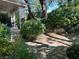 Tranquil backyard featuring lush landscaping and a shaded patio at 1782 Castro Hill Ave, Henderson, NV 89012