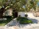Inviting home with a two-car garage, lush landscaping, and a charming front entrance at 1782 Castro Hill Ave, Henderson, NV 89012