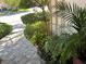 The beautifully landscaped front yard features a variety of plants and stonework, enhancing the property's charm at 1782 Castro Hill Ave, Henderson, NV 89012