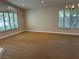 Neutral living room with large windows, plantation shutters, and a chandelier at 1782 Castro Hill Ave, Henderson, NV 89012