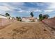 Large, empty backyard space enclosed by brick walls, ready for landscaping and outdoor living at 1816 Mazzanti Way, Henderson, NV 89014