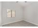 Minimalist bedroom featuring carpet flooring, a neutral color scheme, and a window with natural light at 1816 Mazzanti Way, Henderson, NV 89014