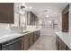 Spacious kitchen featuring sleek countertops, ample cabinet space, and modern stainless steel appliances at 1816 Mazzanti Way, Henderson, NV 89014