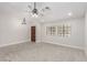 Bright living room with ceiling fan, fresh paint, new carpet, and ample natural light from windows at 1816 Mazzanti Way, Henderson, NV 89014