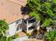 Aerial view of a condo building with two-story balconies and mature trees at 1830 N Buffalo Dr # 2014, Las Vegas, NV 89128