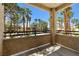 Balcony view of the pool, palm trees and nearby condo buildings on a sunny day at 1830 N Buffalo Dr # 2014, Las Vegas, NV 89128