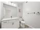 Contemporary bathroom showcasing a granite vanity, commode, and modern fixtures at 1830 N Buffalo Dr # 2014, Las Vegas, NV 89128