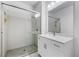 Modern bathroom features glass shower doors, light vanity, and sleek fixtures at 1830 N Buffalo Dr # 2014, Las Vegas, NV 89128
