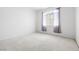 Well-lit bedroom featuring plush carpeting and a window with sheer curtains at 1830 N Buffalo Dr # 2014, Las Vegas, NV 89128