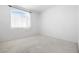 Simple bedroom with carpet flooring and a window letting in natural light at 1830 N Buffalo Dr # 2014, Las Vegas, NV 89128