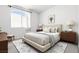 Cozy bedroom with neutral tones, and a plush bed with decorative pillows at 1830 N Buffalo Dr # 2014, Las Vegas, NV 89128
