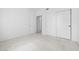 Bedroom with carpet, and a double closet with sliding doors for storage at 1830 N Buffalo Dr # 2014, Las Vegas, NV 89128