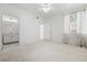 Spacious bedroom featuring a bathroom view, carpet floors, and natural light from the window at 1830 N Buffalo Dr # 2014, Las Vegas, NV 89128