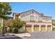 Exterior view of garage condos with red tile roofs, desert landscaping and nearby parking spaces at 1830 N Buffalo Dr # 2014, Las Vegas, NV 89128
