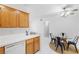Kitchen and dining area with modern appliances and a glass table at 1830 N Buffalo Dr # 2014, Las Vegas, NV 89128