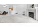 Open living space with a cozy fireplace, dining area, and bright kitchen at 1830 N Buffalo Dr # 2014, Las Vegas, NV 89128