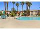 Beautiful pool area with tall palm trees and lounge chairs at 1830 N Buffalo Dr # 2014, Las Vegas, NV 89128